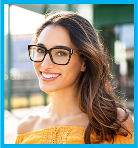 cute young woman with large eye glasses smiles